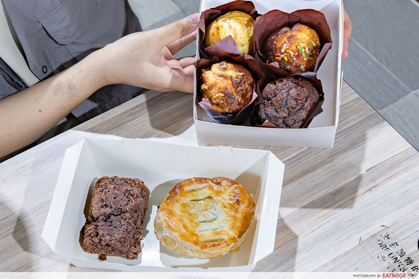A spread of Bakes n Bites muffins with a chewy brownie and a chicken pie